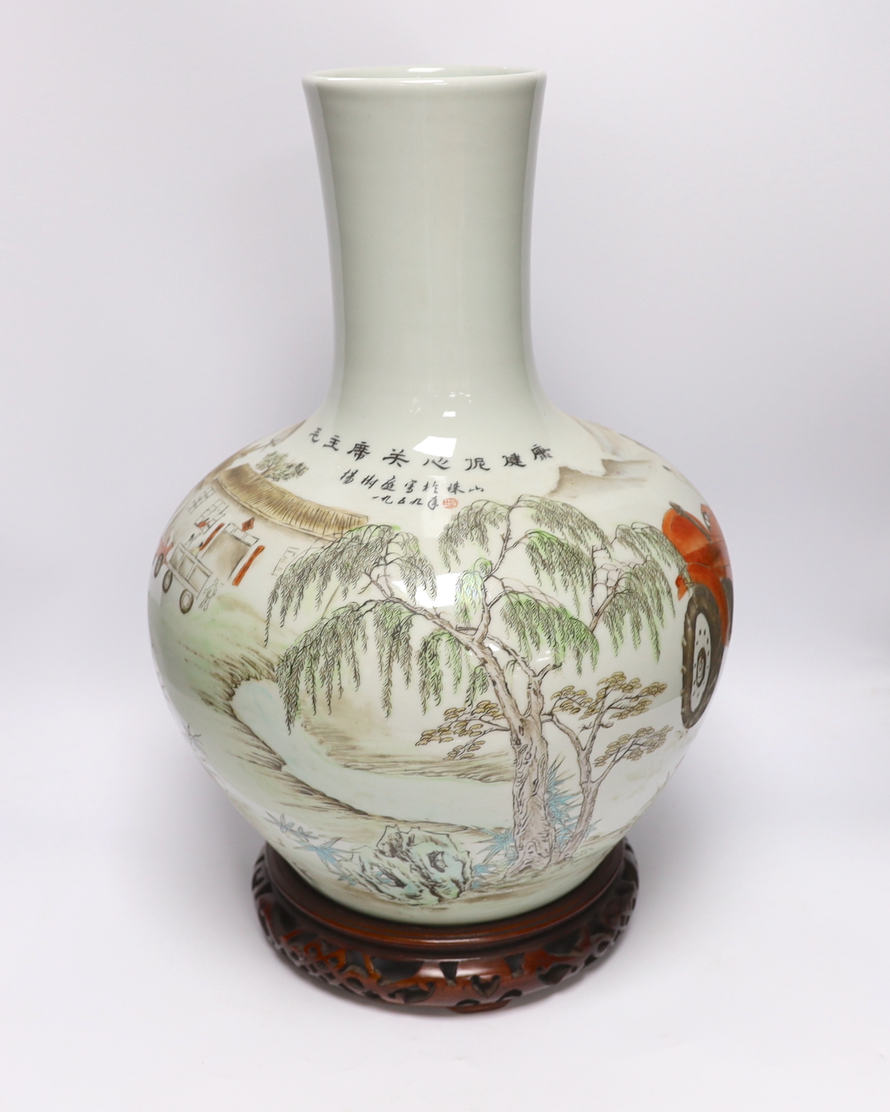 A Chinese Cultural Revolution style enamelled porcelain vase on stand, 50cm high including stand